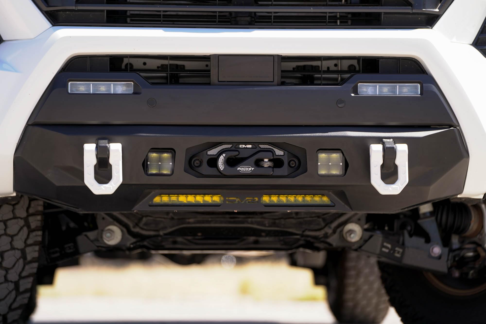 Front Bumper DV8 Centric for 2024 Toyota Tacoma | One 20-Inch Single Row Light Bar & Two 3-Inch Pod Light Mounts | Integrated Standard Winch & D-Ring Mounts | Micro-Texture Black Powder Coat Finish