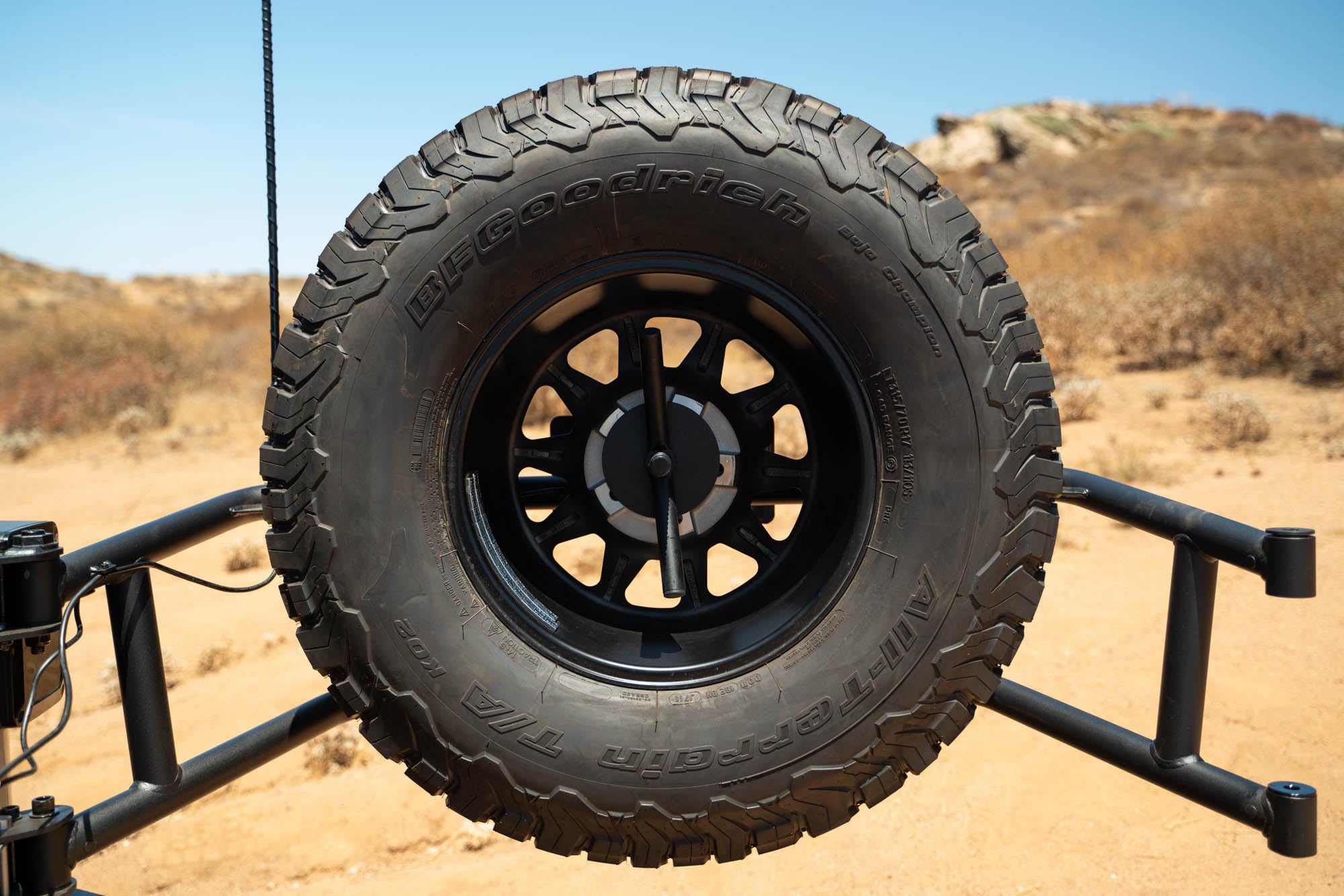 Tire Carrier Body Mounted for 2007-2018 Jeep Wrangler JK | Improves Departure Angle | Transfers Weight from The Door Hinges to The Vehicle Body | LED License Plate Light | 2 Whip Flag/Antenna Mounts