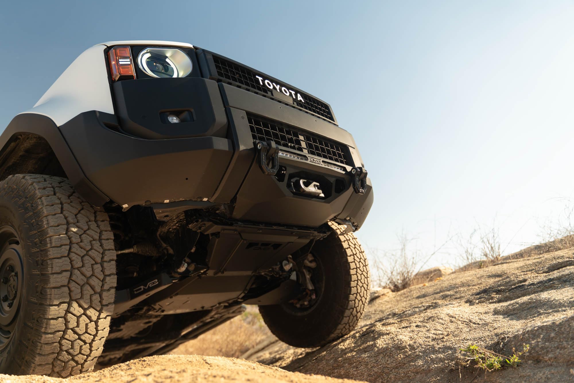 Centric DV8 Offroad Front Bumper for 2024 Toyota Land Cruiser | Center Mount Design | Heavy-Duty Winch Mount | (1) 20" Single Row Light Bar Mount | Pair of D-Ring Mounts | Powder Coated Black | Steel