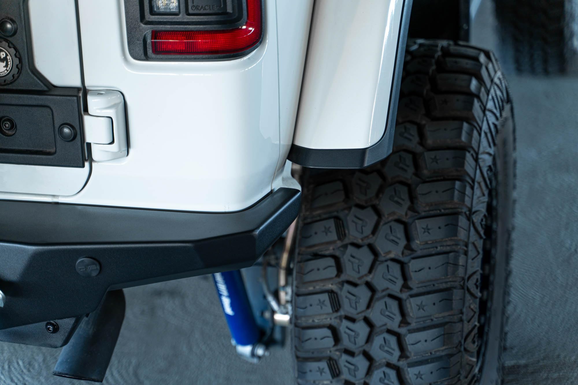 FS-15 Series DV8 Offroad Rear Bumper for the 2018-2025 Jeep Wrangler JL | Compatible with Factory Hitch | License Plate Relocation Bracket with Plate Light | Welded-in Zip Tie Tabs