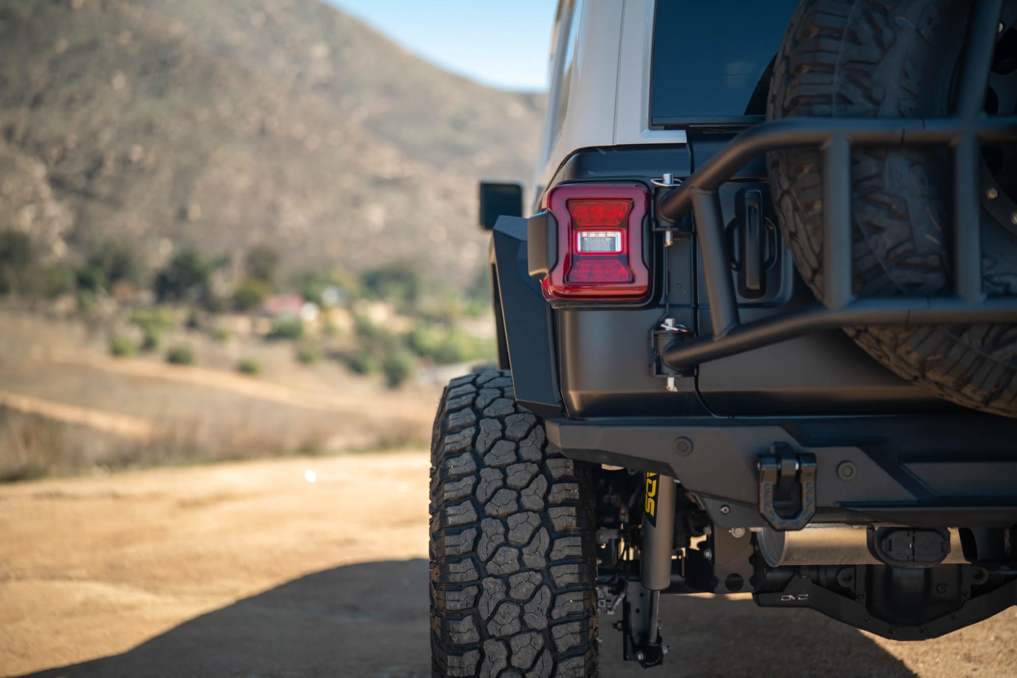 Armor Fender Flares DV8 Offroad for 2018-2025 Jeep Wrangler JL | Narrow Width | Rigid Armor-Plated Steel Design | (2) Amber Turn Signals | Paintable Mesh Aluminum Accent Panels | Powder Coated Black