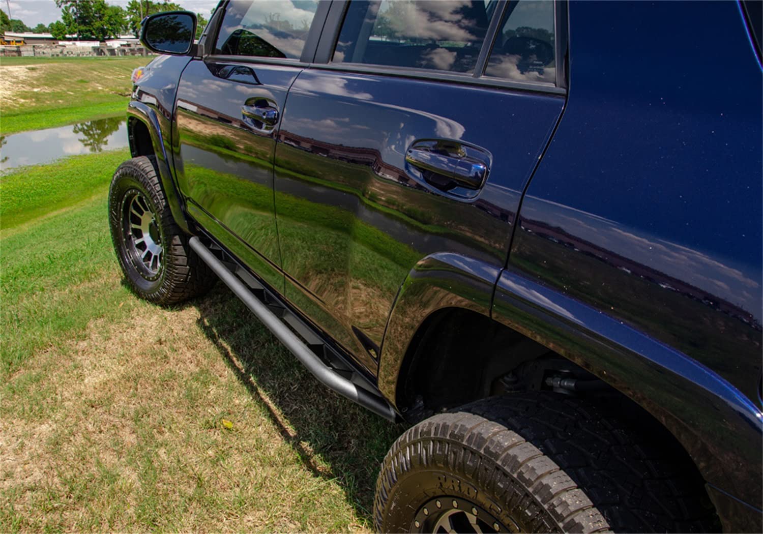 Trail Sliders RealTruck for Toyota Tacoma | Cab Length, Heavy Duty 2" Tubing, Textured Black | TST05CC-TX | Fits 2005 - 2015 Toyota Tacoma Double Cab
