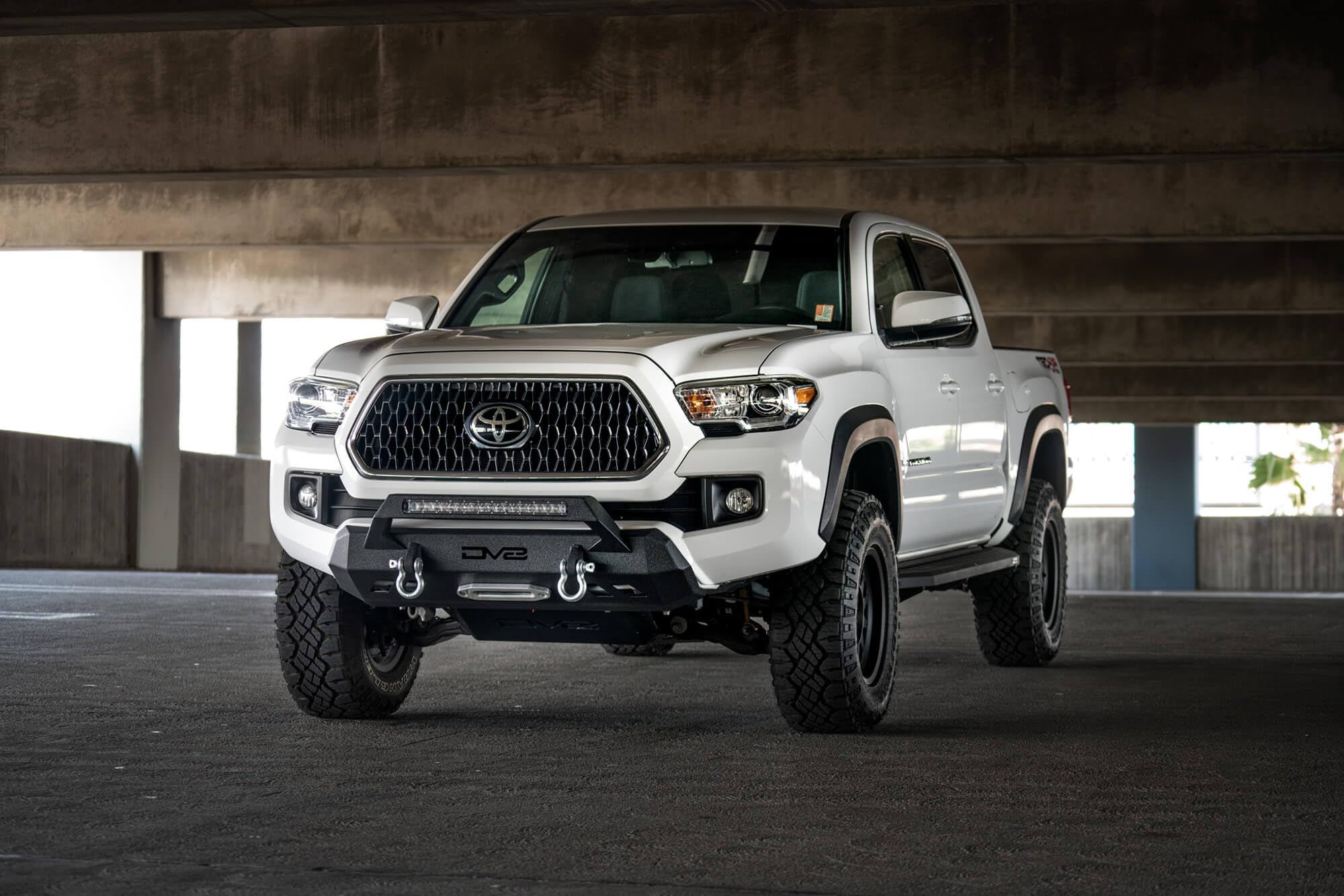 FBTT1-05 DV8 Offroad | Front Bumper fits 2016-2021 Toyota Tacoma | Center Inlay Only | Winch Mount Included | Bull Bar | Strategic Airflow Cutouts | Welded Light Tabs, Black