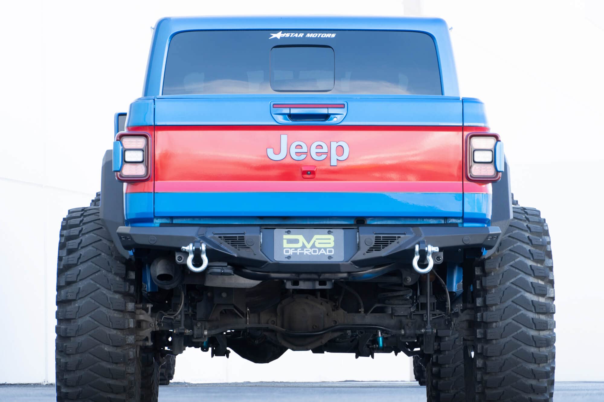 DV8 Offroad Rear Bumper Spec Series for 2020-2025 Jeep Gladiator JT | High Clearance Design | Accepts (2) up to 3" Pod Lights | Compatible OEM Hitch & Factory Sensors | ¾” D-Ring Shackles