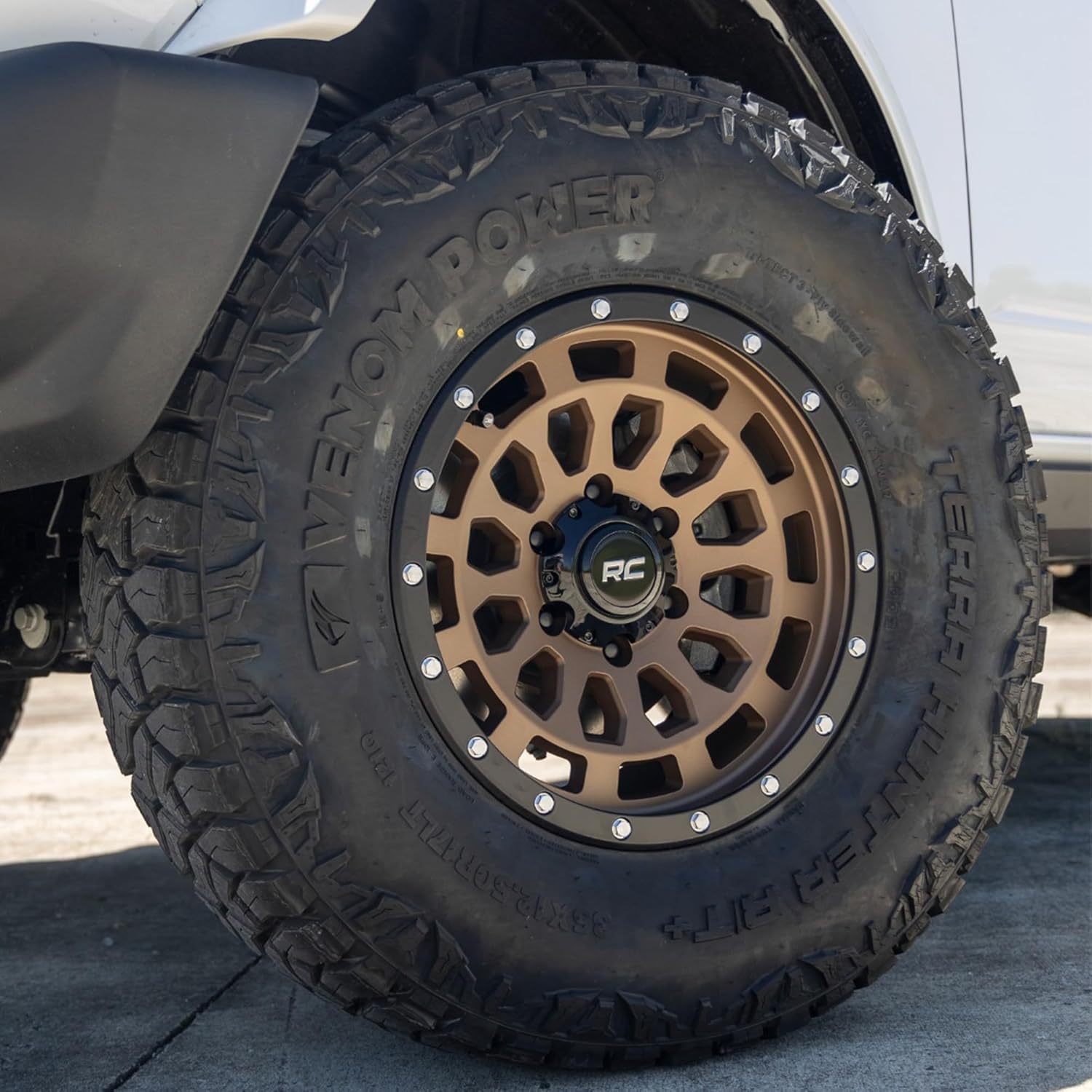 17x8.5" Rough Country Bronze Aluminum Wheel with Black Ring & Simulated Beadlock - 6x5.5 Bolt Pattern, +25mm Offset, Durable One-Piece Rim for Trucks & Jeeps 87 Series