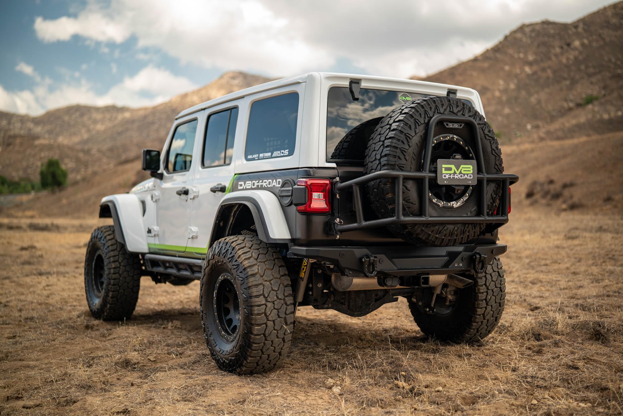 DV8 Offroad Tire Carrier Body Mounted for 2018-2025 Jeep Wrangler JL | Removes Weight of Spare from Door Hinges | Fits Up to a 40 x 13.50 Tire with a -25 Max Offset | Improves Departure Angle | Steel