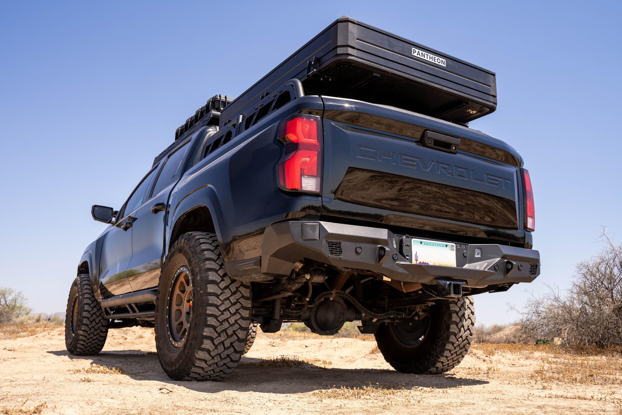 Rear Bumper DV8 Offroad Spec Series for 2023-2024 Chevy Colorado & GMC Canyon | Two 3" Pod Light Mounts | Integrated D-Ring Mounts | Retains Blind Spot Monitoring & Sensors | Powder Coated | Steel