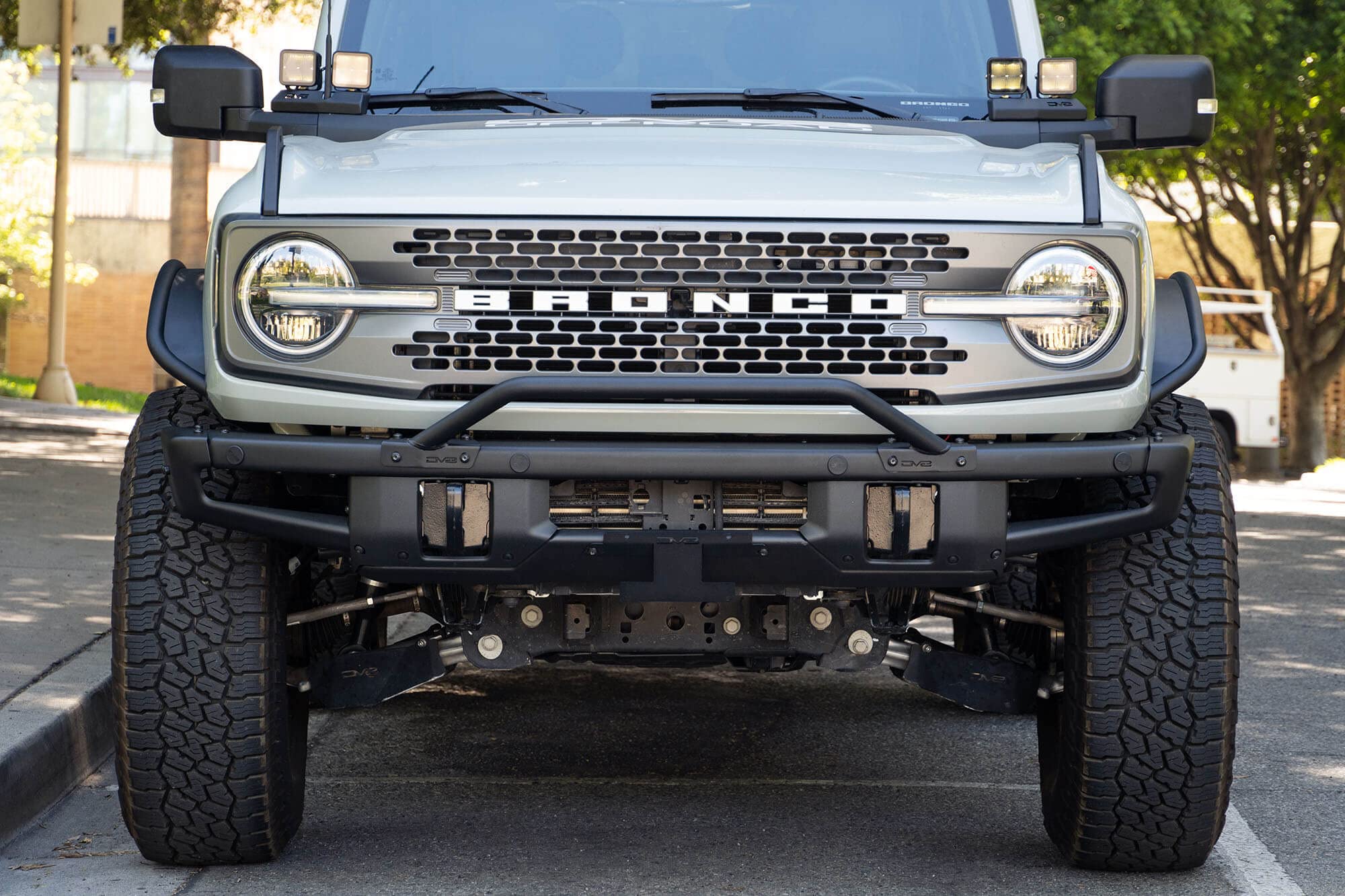 License Plate Relocation Bracket DV8 Offroad for 2021-2024 Ford Bronco | OEM Steel Front Bumper | Lower Center Mount | Keeps Grille Open | Quick & Easy Installation