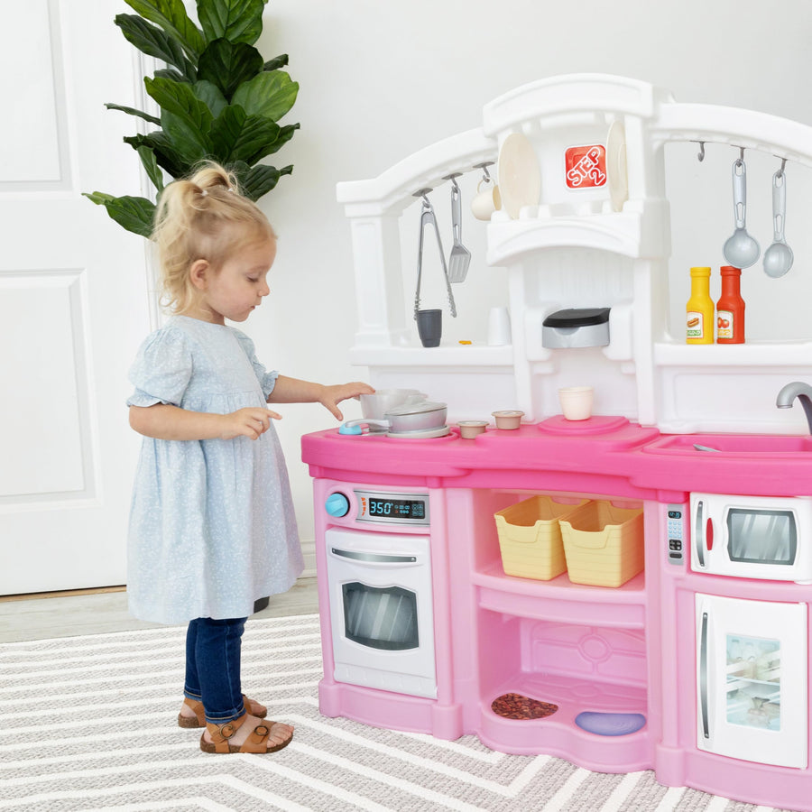 Step2 Fun with Friends Kitchen Playset Kids, Indoor/Outdoor Kitchenette, Interactive Play with Lights and Sounds, Durable Plastic, Includes 25 Piece Toy Accessories, Toddlers 2+ Years Old, Pink