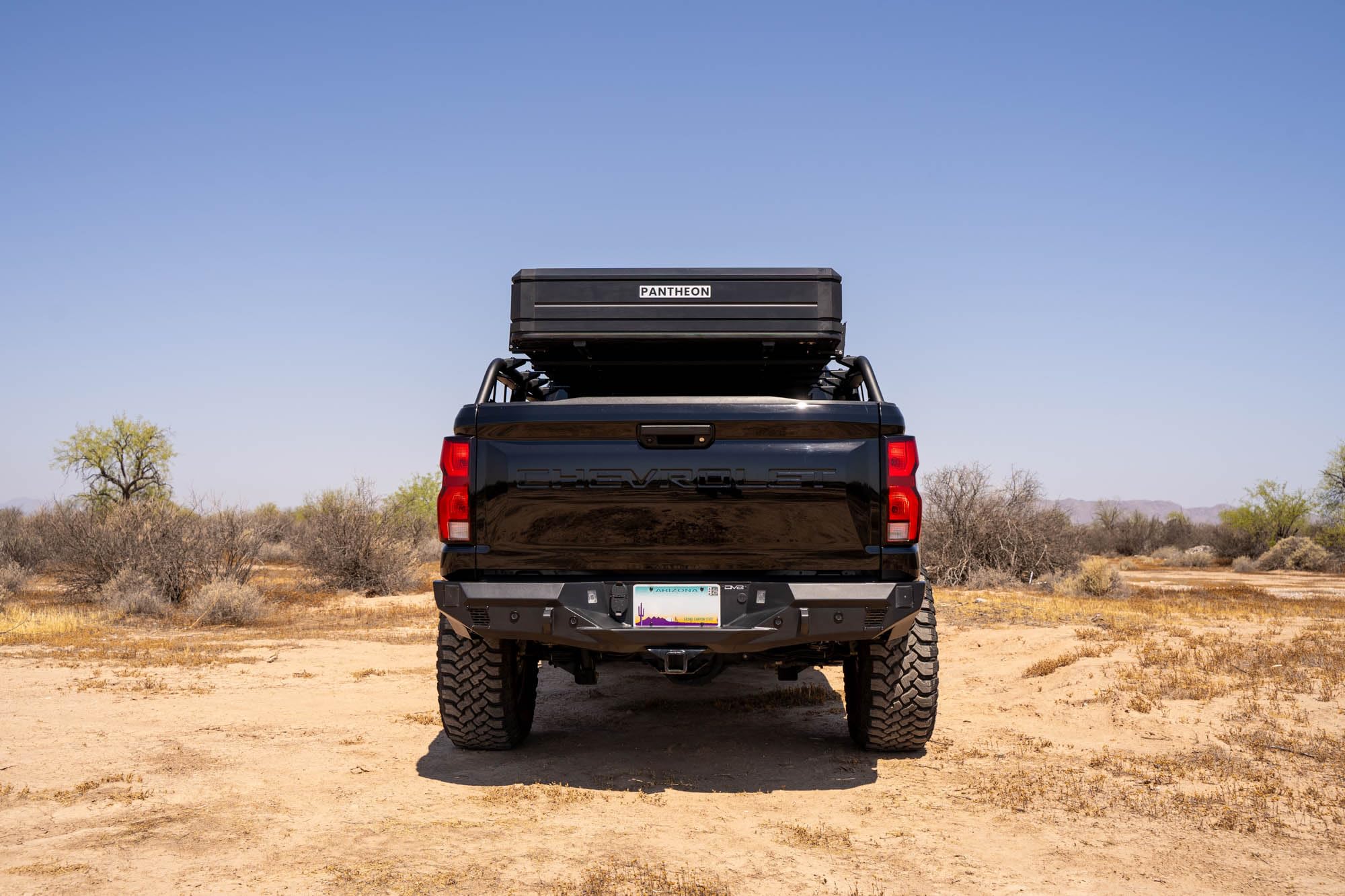 Rear Bumper DV8 Offroad Spec Series for 2023-2024 Chevy Colorado & GMC Canyon | Two 3" Pod Light Mounts | Integrated D-Ring Mounts | Retains Blind Spot Monitoring & Sensors | Powder Coated | Steel