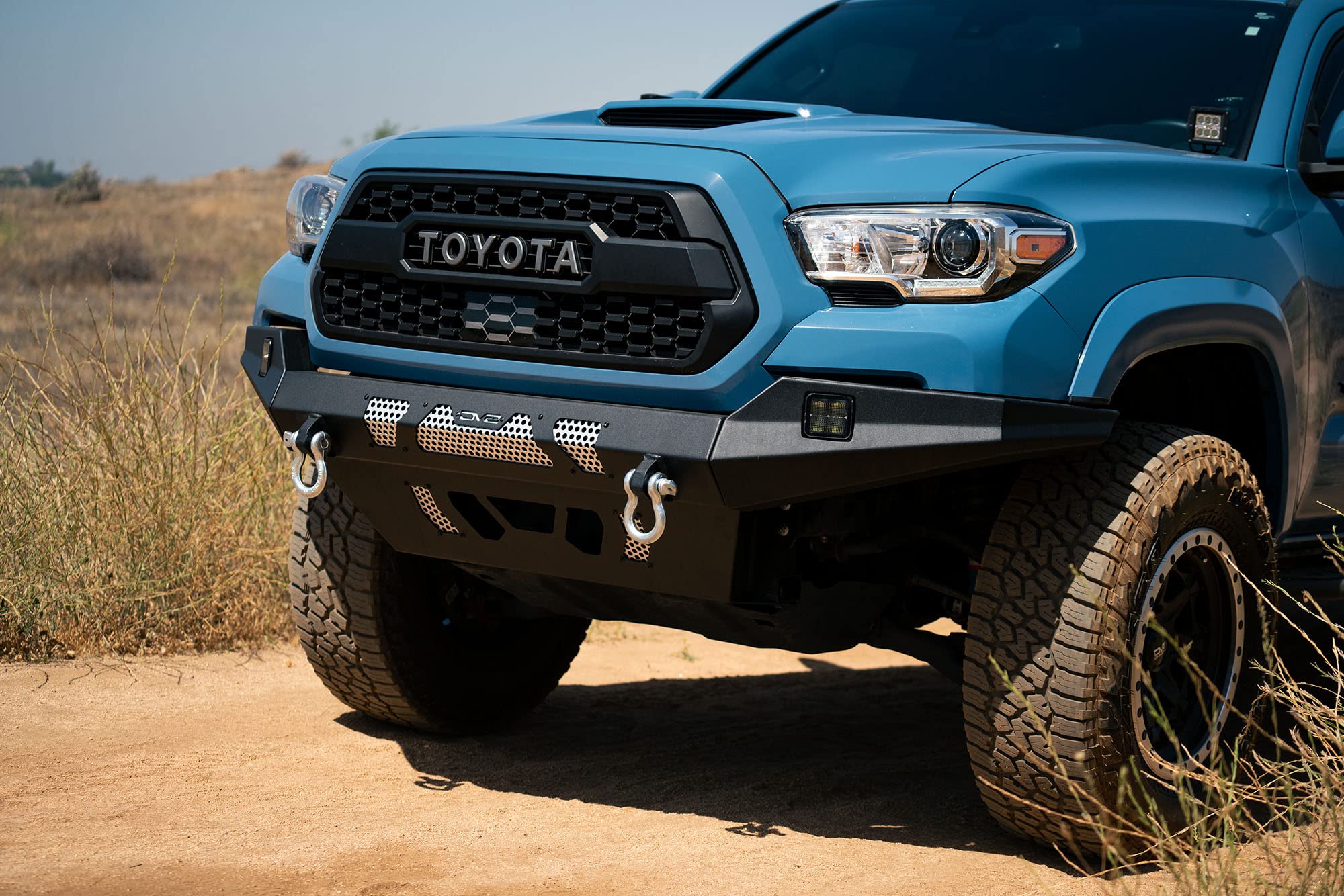MTO Series DV8 Offroad Front Bumper for 2016 - Current Tacoma | Low Profile | Auxiliary Light and D-ring Mounts | Paintable Mesh Panels | 3pc Steel Construction | FBTT1-04