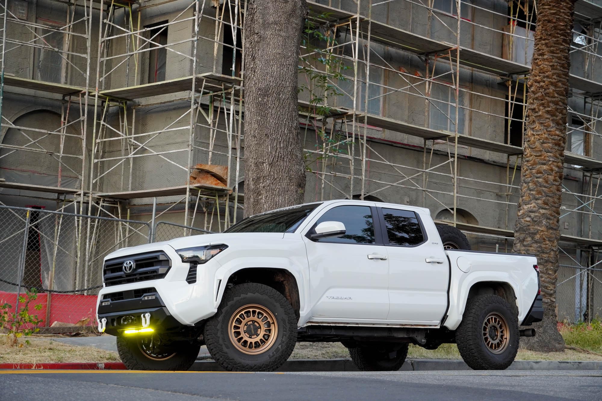 Front Bumper DV8 Centric for 2024 Toyota Tacoma | One 20-Inch Single Row Light Bar & Two 3-Inch Pod Light Mounts | Integrated Standard Winch & D-Ring Mounts | Micro-Texture Black Powder Coat Finish
