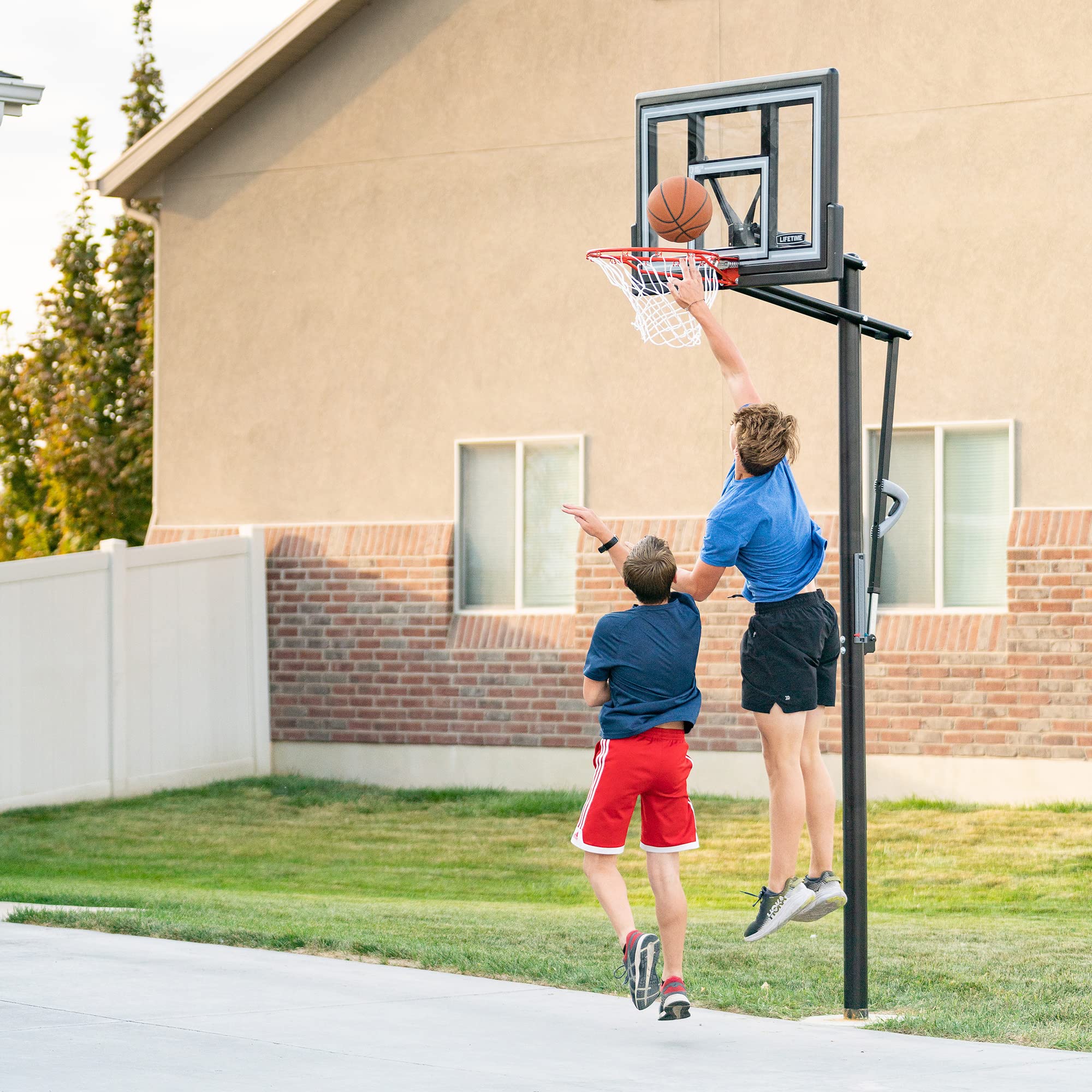 Lifetime Basketball Hoop Adjustable In-Ground, Action Grip Height Adjustment 7.5-10 Ft, 50-Inch Shatterproof Fusion Backboard, Slam-It Rim, Powder-Coated Steel Pole