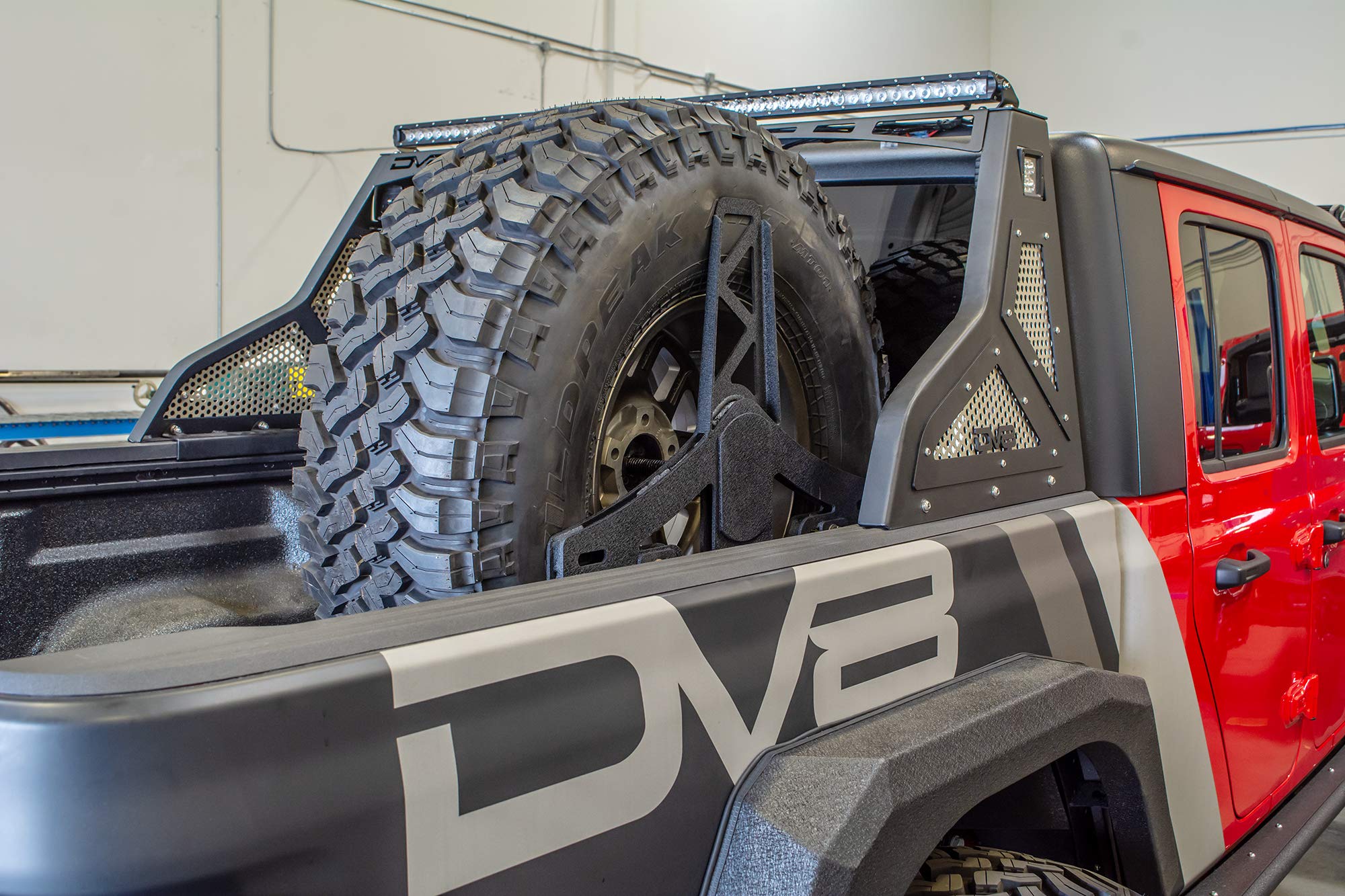 Spare Tire Mount DV8 Offroad for The 2020-2025 Jeep Gladiator JT | Vertical in-Bed Design | Accommodates up to 42" Tire | Mounts Either Bed Rail | Powder Coat Finish