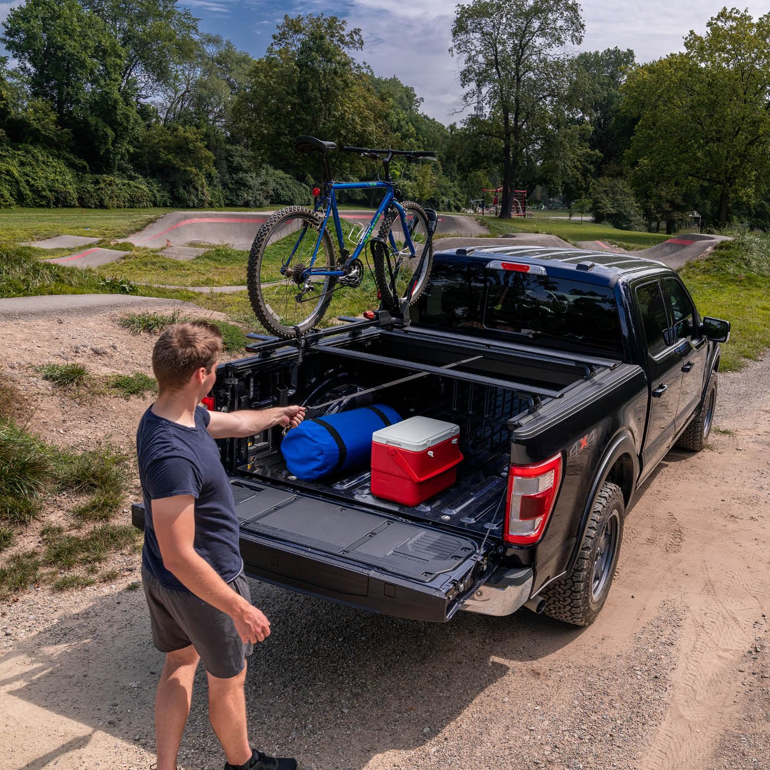 Roll-N-Lock M-Series XT Retractable Truck Bed Tonneau Cover | 402M-XT | Fits 2019 - 2025 Dodge Ram 1500/2500/3500, Does Not Fit w/ Multi-Function (Split) Tailgate 6' 4" Bed (76.3")