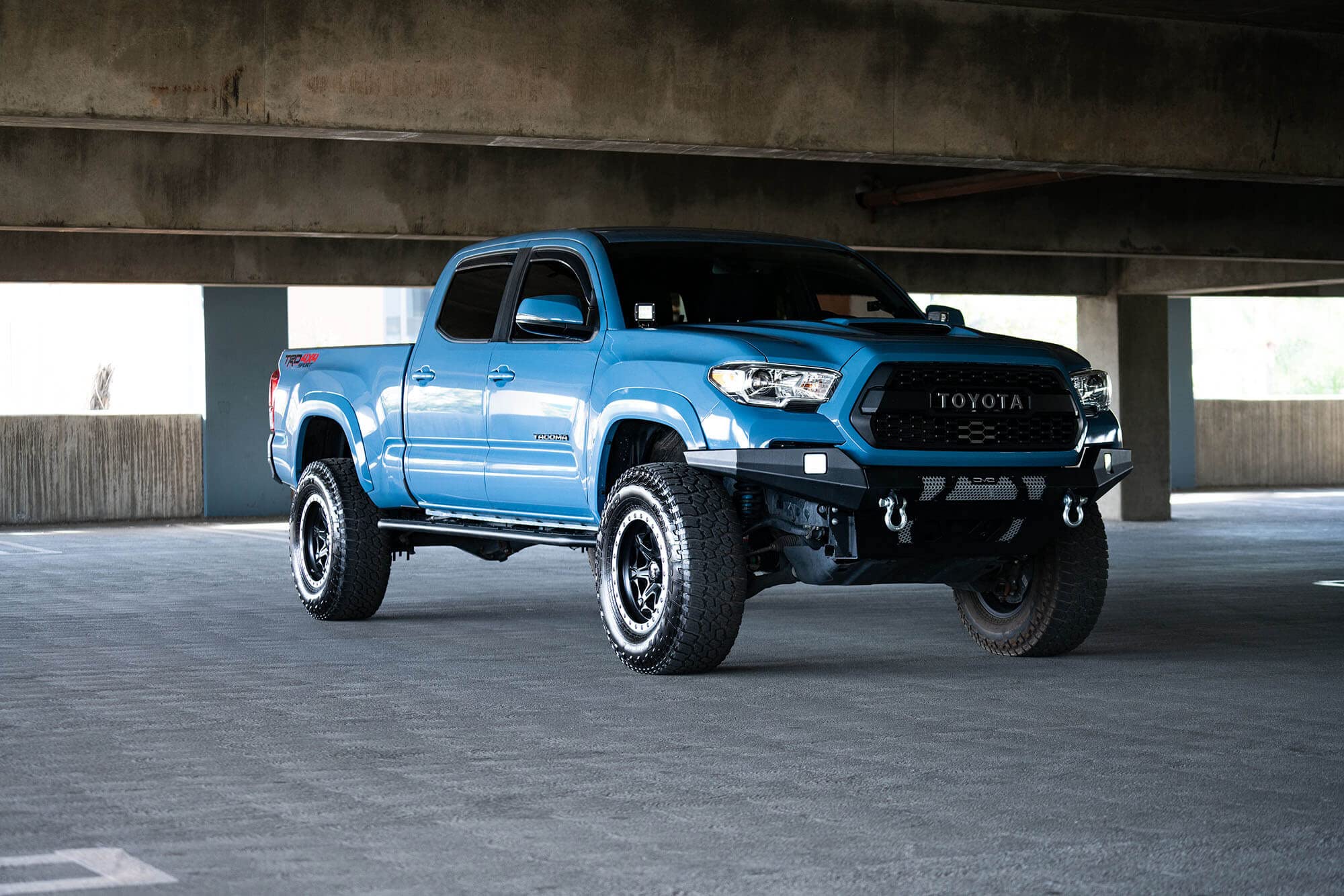 MTO Series DV8 Offroad Front Bumper for 2016 - Current Tacoma | Low Profile | Auxiliary Light and D-ring Mounts | Paintable Mesh Panels | 3pc Steel Construction | FBTT1-04