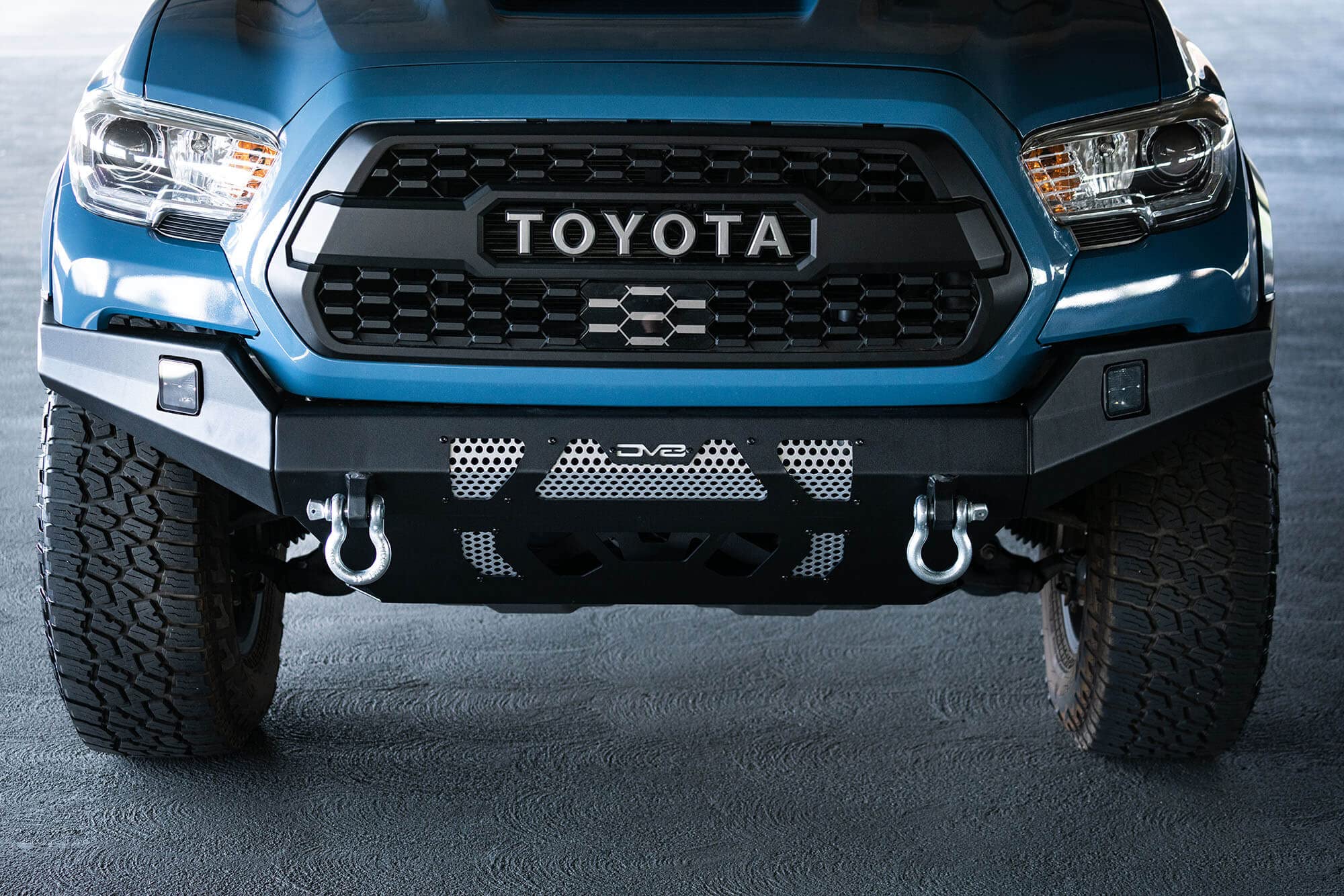 MTO Series DV8 Offroad Front Bumper for 2016 - Current Tacoma | Low Profile | Auxiliary Light and D-ring Mounts | Paintable Mesh Panels | 3pc Steel Construction | FBTT1-04