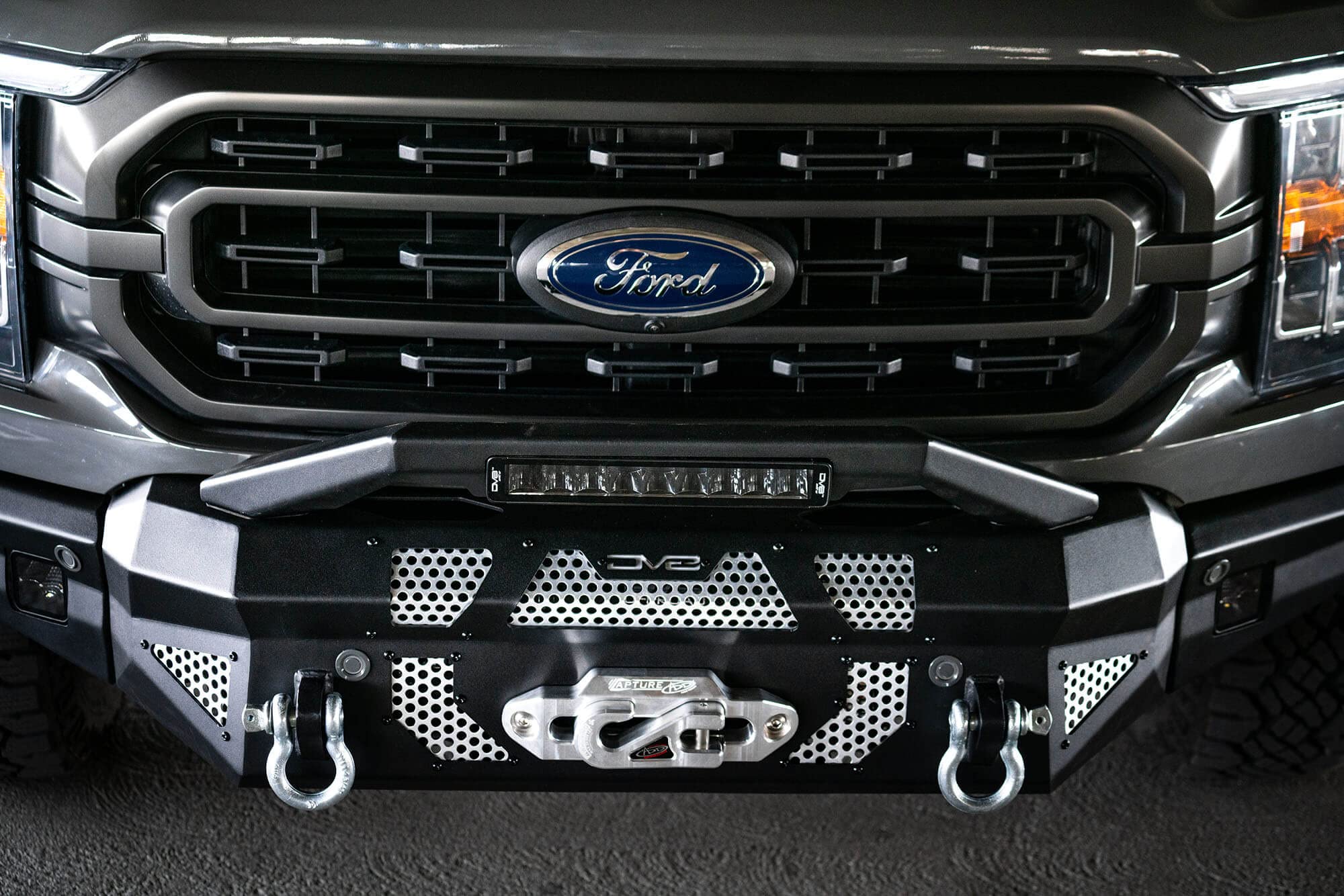 FBFF1-10 | DV8 Offroad | MTO Series Front Bumper for 2021-Current F-150 | 3 Pc Modular Construction | Factory Sensor Compliant | Integrated Winch Mount | Strategic Airflow Cutouts | LED Light Mounts