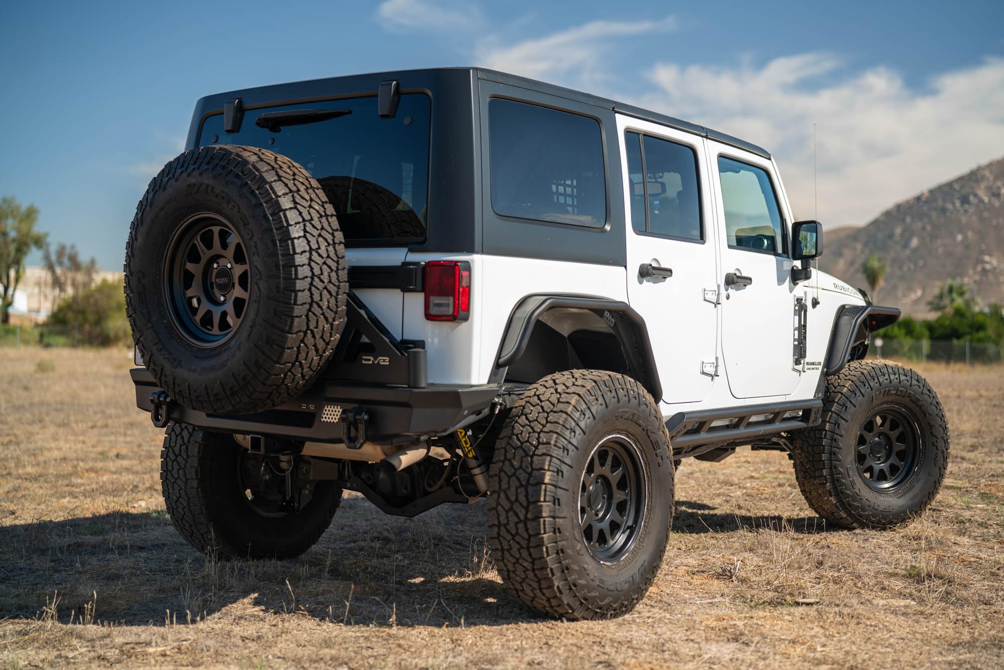 Rear Inner Fenders DV8 Offroad for 2007-2018 Jeep Wrangler JK | Aluminum Design for Protecting Inner Wheel Wells | Satin Black Powder Coated Finish | Matches DV8's Front Inner Fenders | Mesh Accents