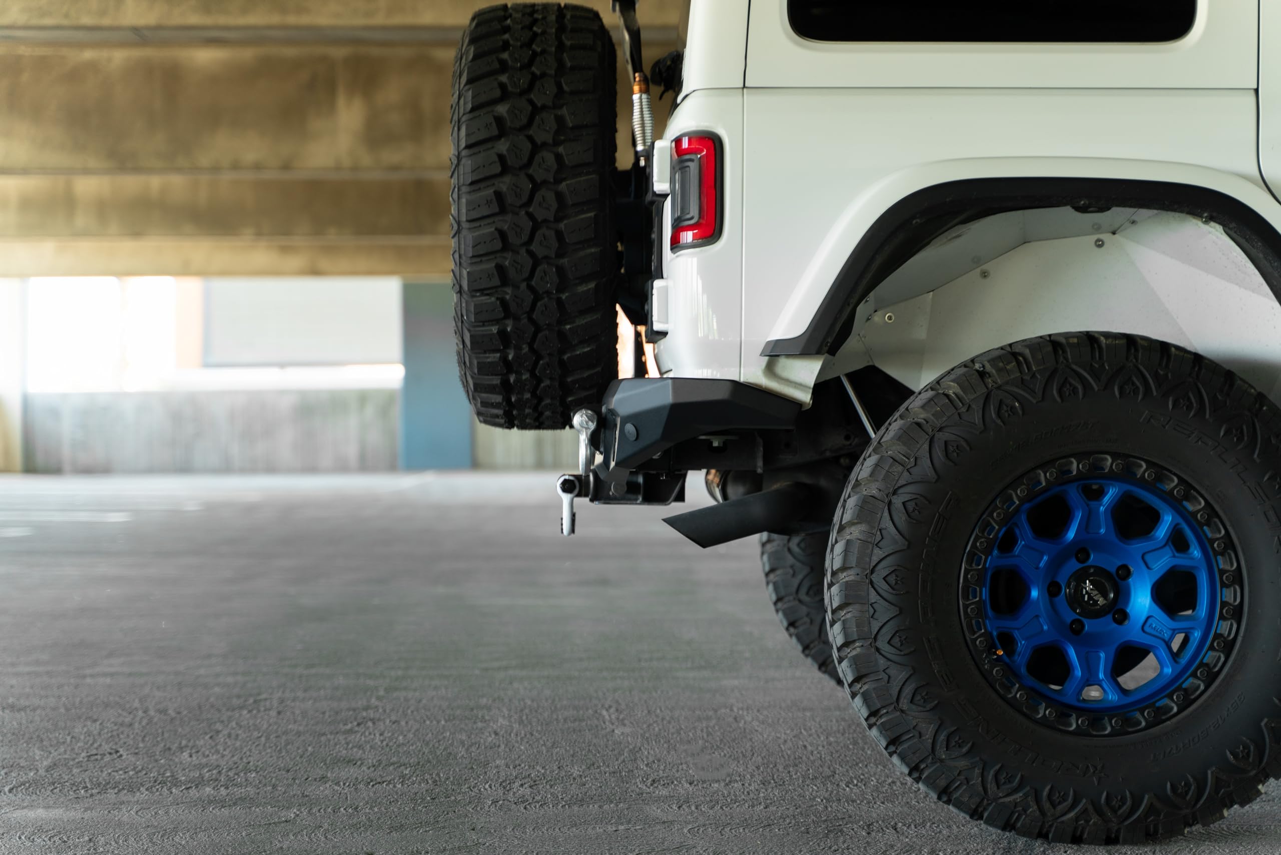 FS-7 Series DV8 Offroad Rear Bumper for the 2018-2025 Jeep Wrangler JL | Sleek Mid-Width Design | Compatible with Factory Hitch | Fits up to 37” Spare Tire Above Bumper Using Factory Carrier