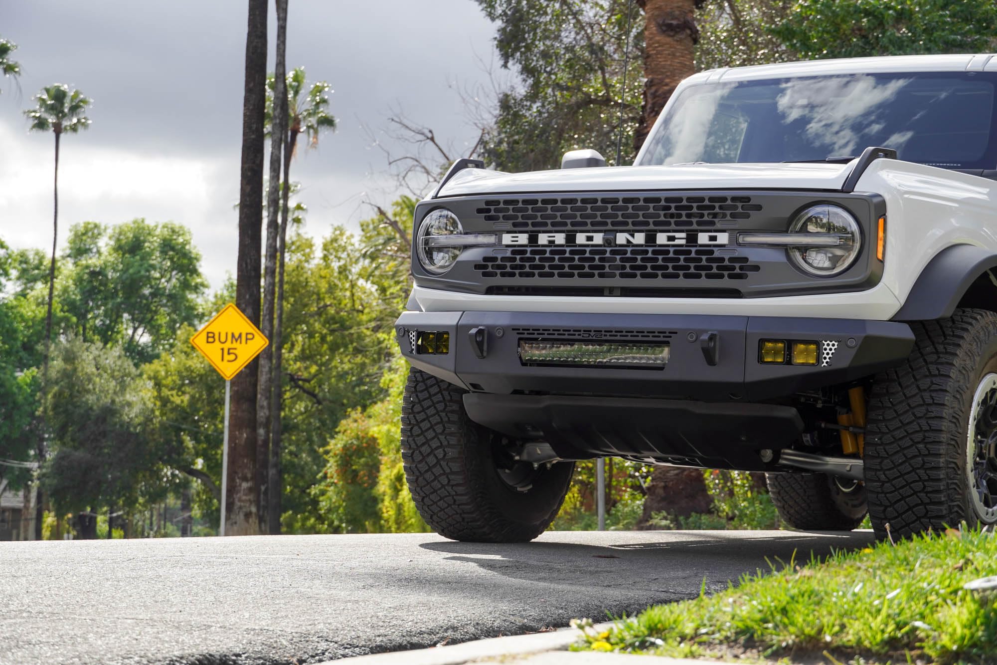 OE Plus Series V2 DV8 Offroad Front Bumper for 2021-2025 Ford Bronco | Low-Profile OE Style Design | Mounts One 20" Light Bar | Mounts Four 3" Pod Lights | Retains Adaptive Cruise Control