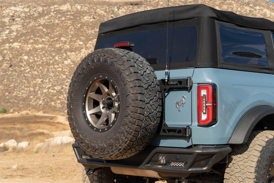 Offroad DV8 Tire Carrier for 2021-2025 Ford Bronco | Heavy-Duty Design | Absorbs Weight of Spare Tire & Tailgate Door | Included Third Brake Light Extension | Fully Bolt-On Installation | Steel
