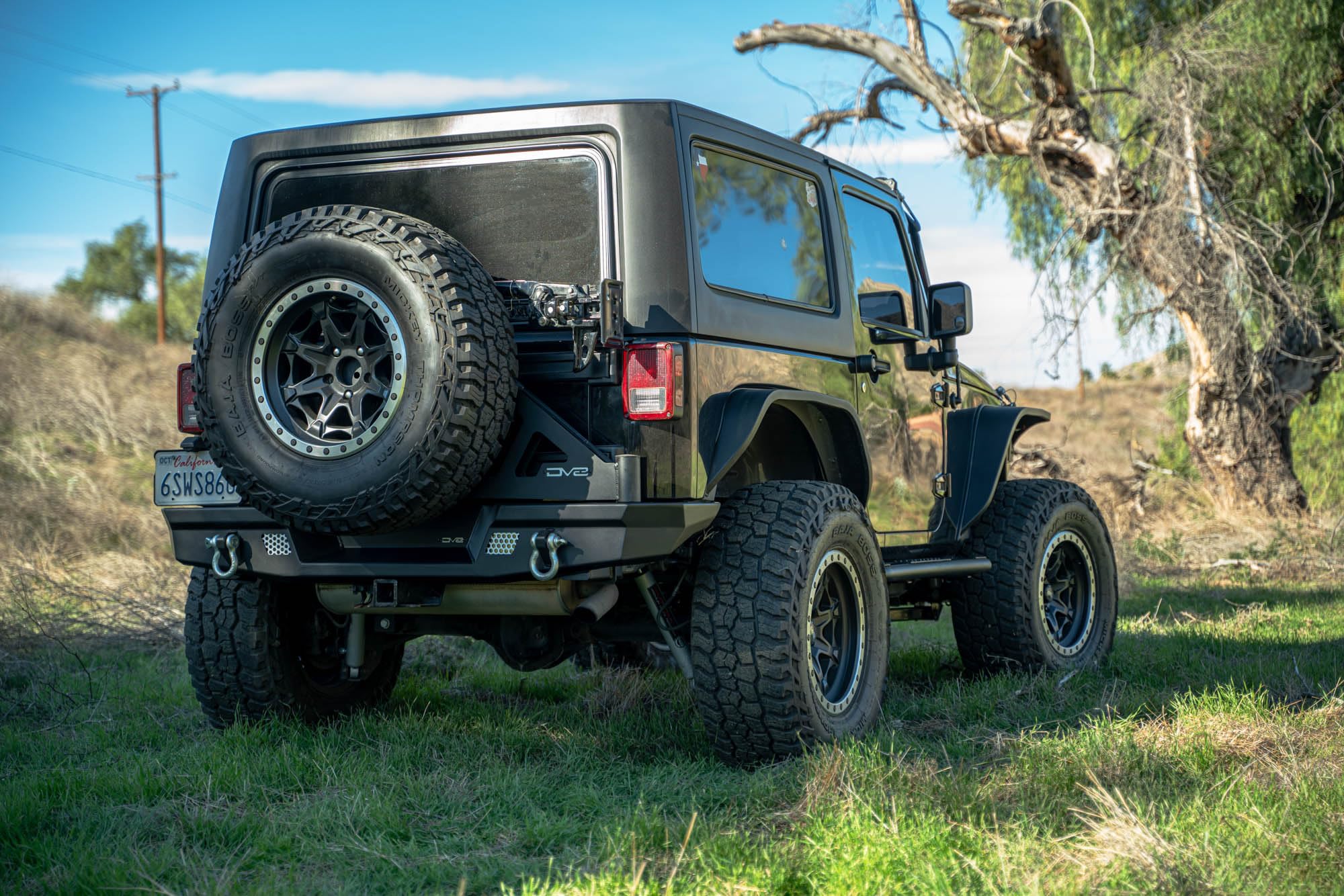 MTO Series DV8 Offroad Rear Bumper for the 2007-2018 Jeep Wrangler JK | Jeep Full-Width Rear Bumper | Mounts for (2) 3” Light Pods | Fits up to 37” Spare Tire (Max 4.5” Backspacing Wheels)