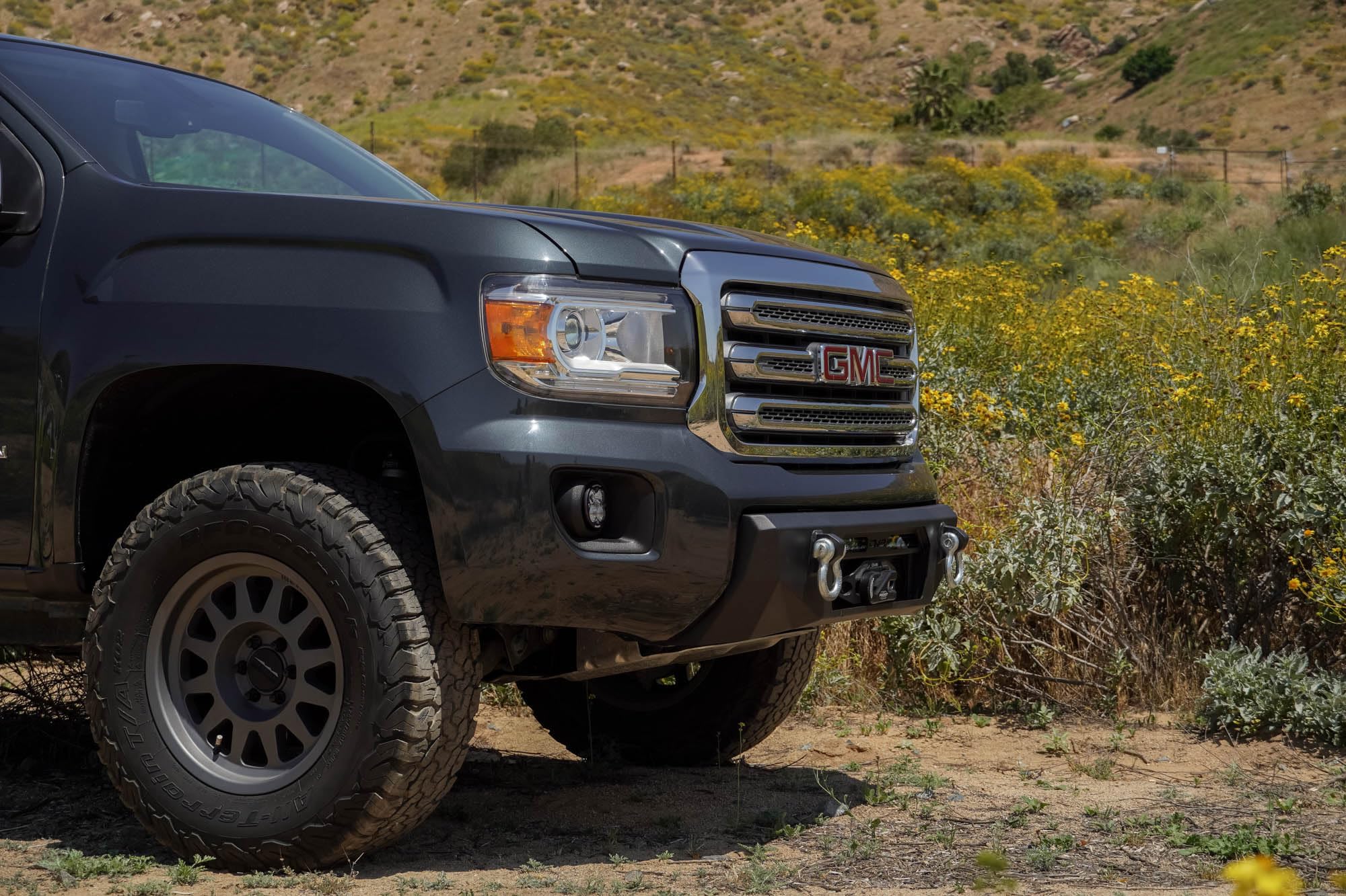 Winch Centric Front Bumper for the 2015-2020 GMC Canyon | Two D-Ring Mounts | One 20-Inch LED Light Bar Mount | Two 3-Inch Pod Light Mounts | Zip Tie Tabs | Micro-Texture Black Powder Coat Finish