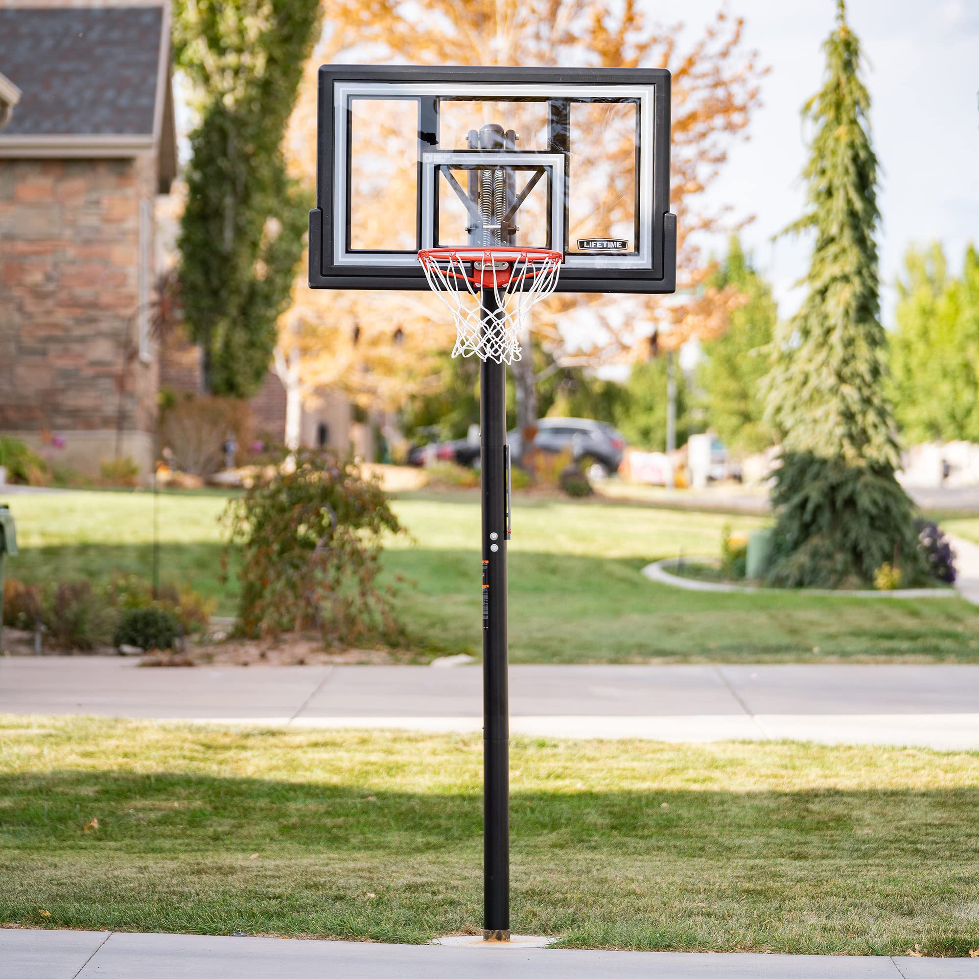Lifetime Basketball Hoop Adjustable In-Ground, Action Grip Height Adjustment 7.5-10 Ft, 50-Inch Shatterproof Fusion Backboard, Slam-It Rim, Powder-Coated Steel Pole