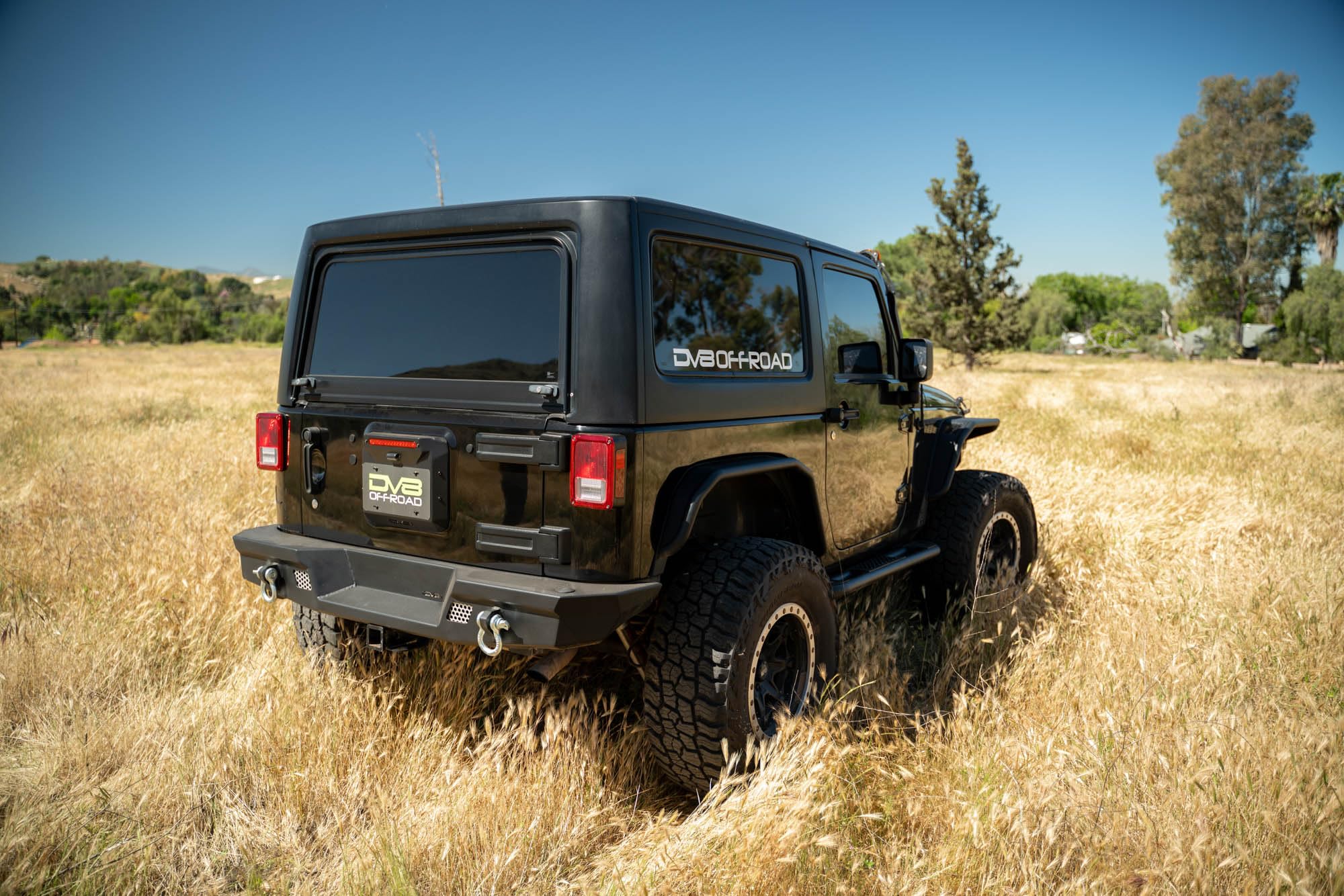 Spare Tire Delete DV8 Offroad for 2007-2018 Jeep Wrangler JK | Replaces Spare Tire Assembly | Maximizes Departure Angle | Features LED License Plate Light | Included Rubber Plugs