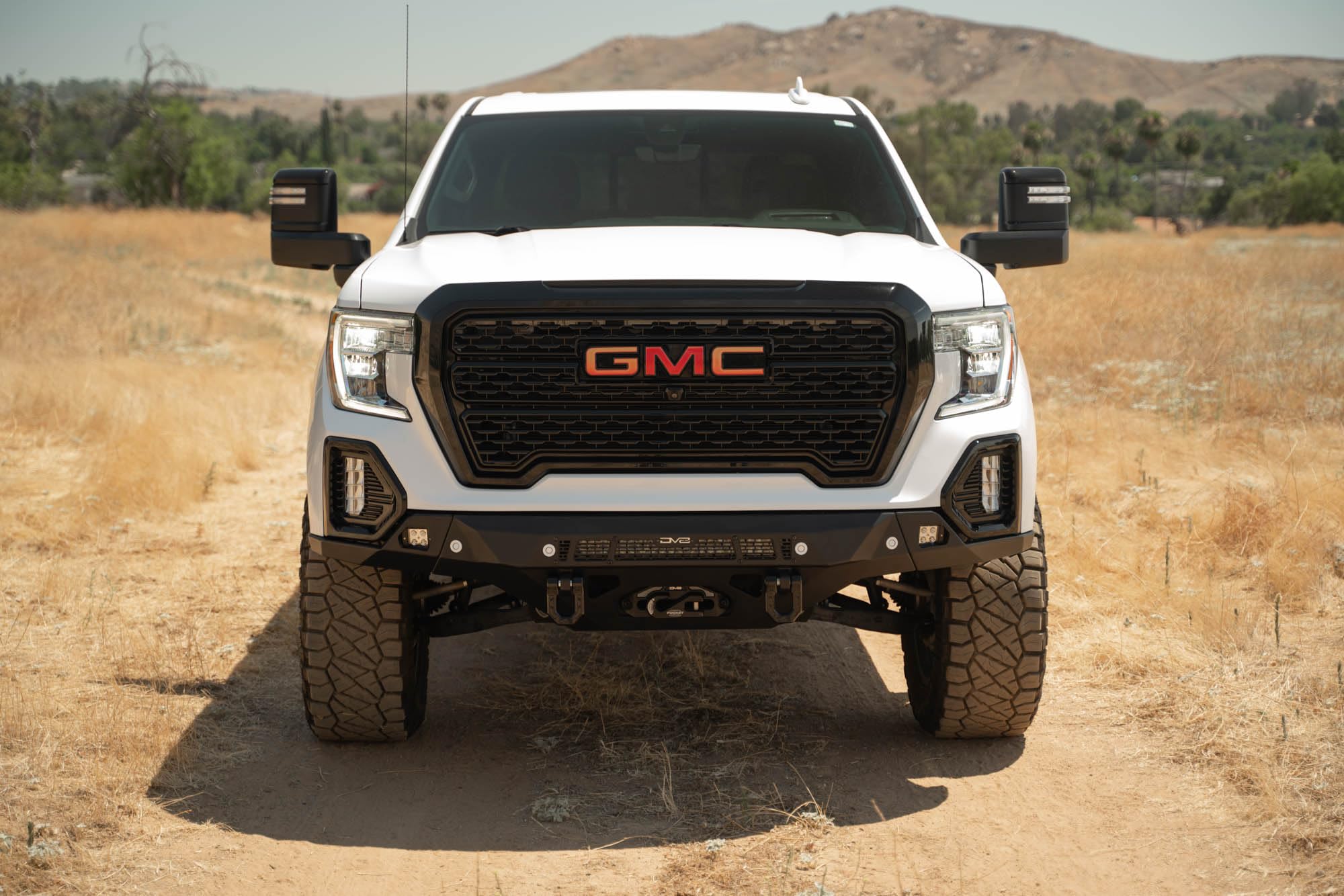 Front Bumper DV8 Spec Series for 2019-2021 GMC Sierra 1500 | Steel Front Skid Plate | One 20" Light Bar Mount | Two 3" Pod Light Mounts | Heavy-Duty Winch Mount | 2 D-Ring Mounts | Powder Coated Black