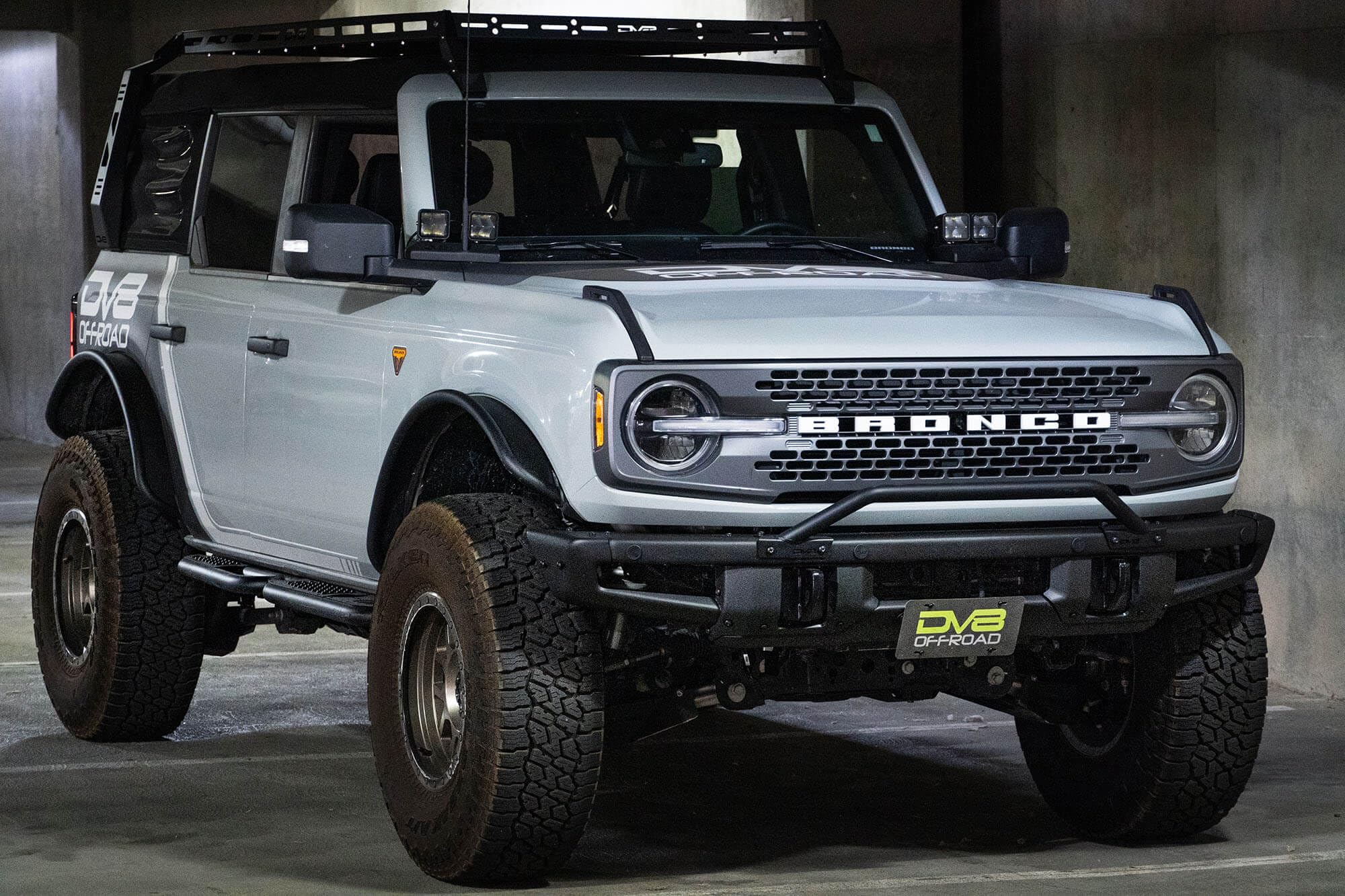 License Plate Relocation Bracket DV8 Offroad for 2021-2024 Ford Bronco | OEM Steel Front Bumper | Lower Center Mount | Keeps Grille Open | Quick & Easy Installation