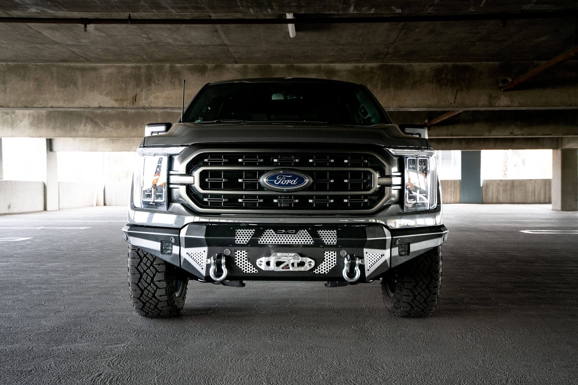 FBFF1-10 | DV8 Offroad | MTO Series Front Bumper for 2021-Current F-150 | 3 Pc Modular Construction | Factory Sensor Compliant | Integrated Winch Mount | Strategic Airflow Cutouts | LED Light Mounts