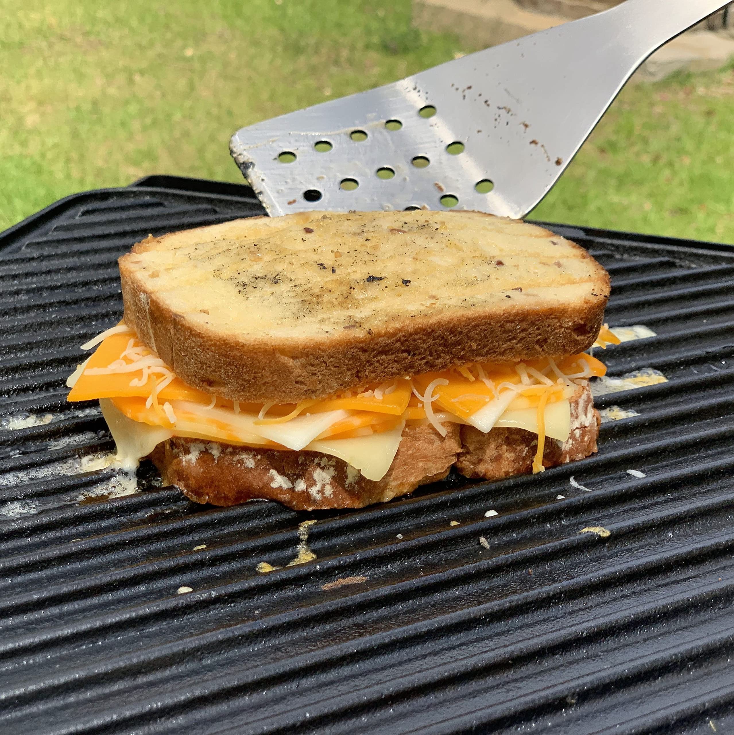Bayou Classic 28-in Cast Iron Reversible Griddle Features Flat Side and Ribbed Grill Side Perfect For Large Batch Breakfast Burgers and Grilled Sandwiches Steaks and Chicken