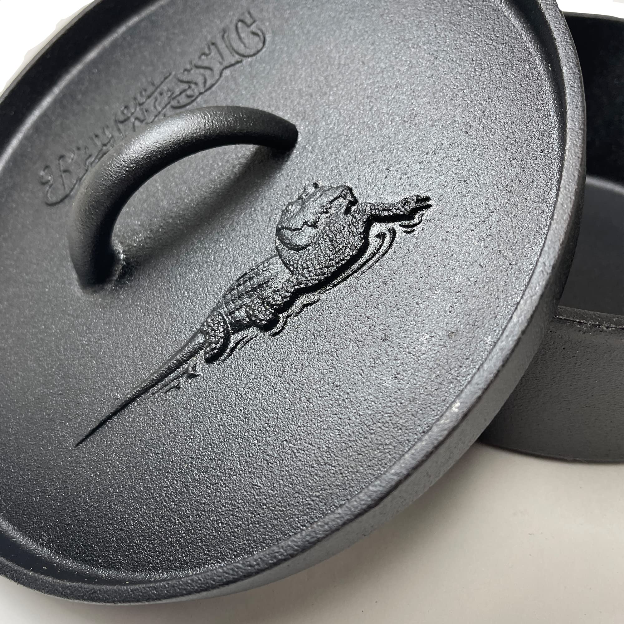 Bayou Classic 2-qt Cast Iron Dutch Oven Features Flanged Camp Lid Stainless Coil Wire Handle Grip Perfect To Use Over A Campfire To Prepare One-Pot Meals Bake Cornbread Biscuits or Cobbler