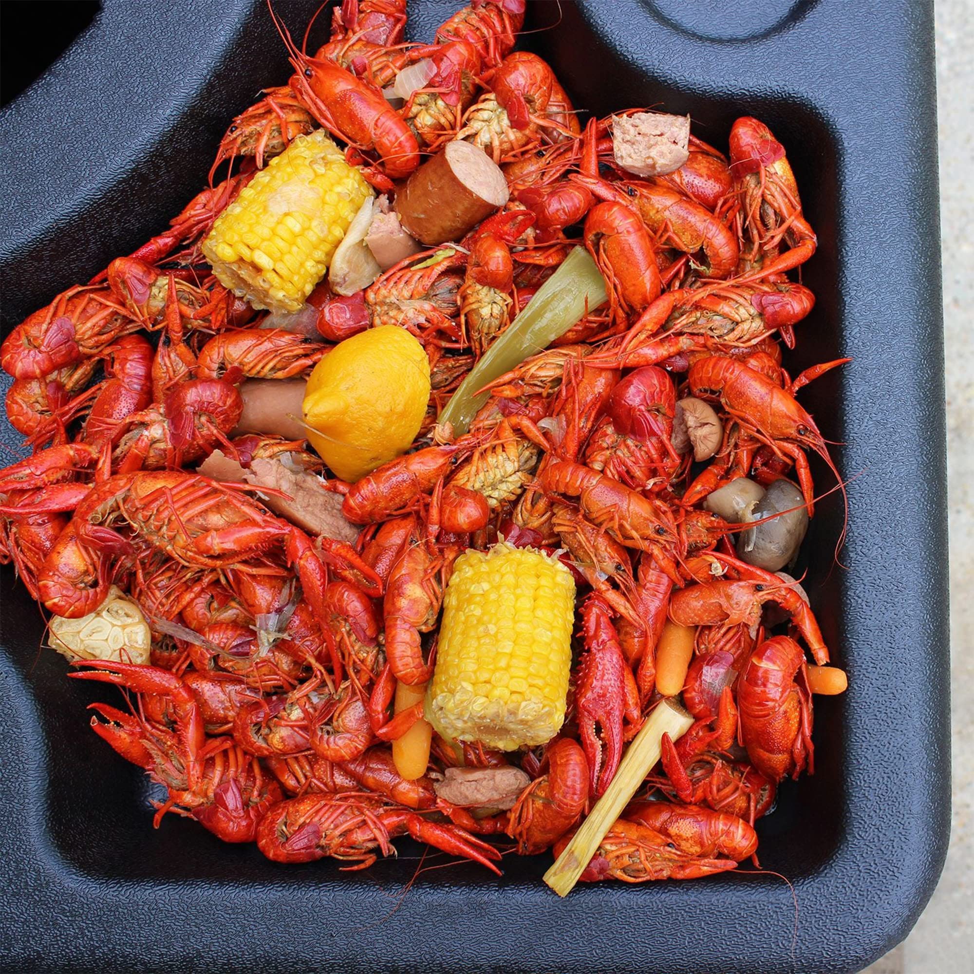 300-444 Bayou Classic Seafood Crawfish Event Table Features 4 Large Serving Areas and 8 Beverage Holders 40-in x 40-in Fits Most Standard Garbage Cans & Secures w/ 2 Bungee Cords Lightweight Portable
